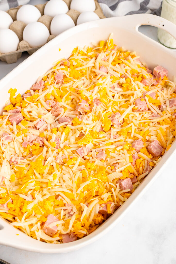 Ham and cheese in a white casserole dish