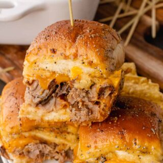 Beef Sliders made with cheese and sliced beef.