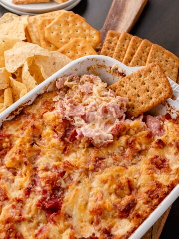 Hot Reuben Dip served with crackers and tortilla chips.
