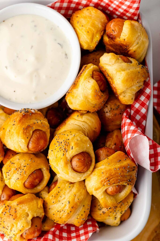 Pigs in a blanket served with ranch dip.