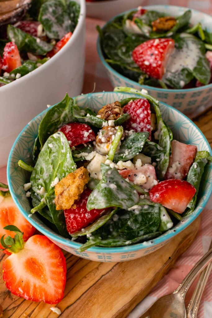 Small bowl with strawberry spinach salad.