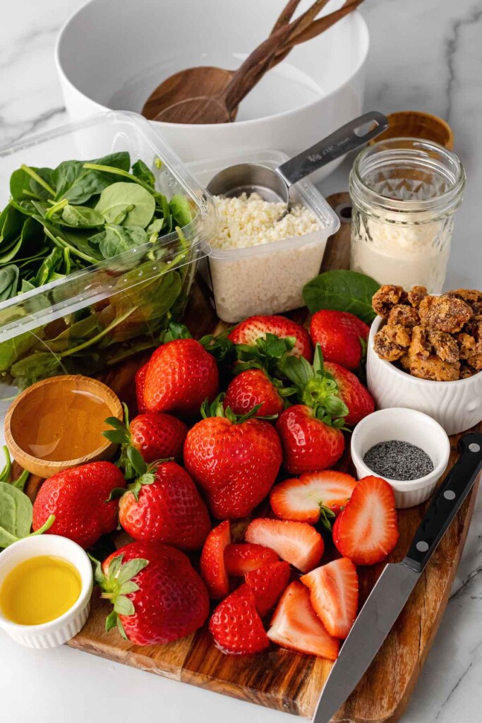 Strawberries, spinach, candied pecans and cheese for a salad.