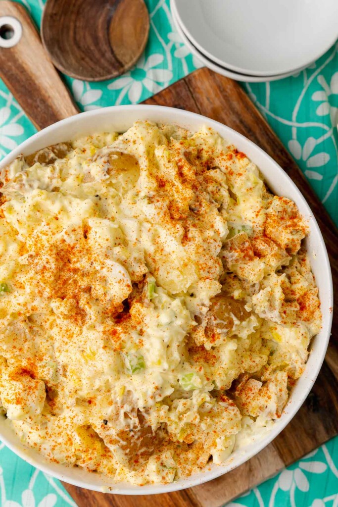 Potato Salad For A Crowd is the perfect side dish! It's an easy make ahead dish with potatoes, eggs, celery and relish mixed with a creamy dressing.