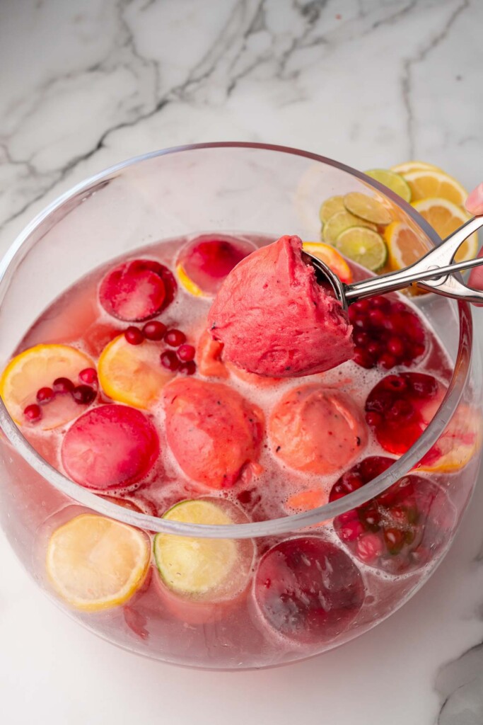 Sparkling Berry Punch is fresh, delicious and perfect for any spring party. Made with cranberry juicy, lemon juicy, sherbert and a little sugar with a beautiful pick color.