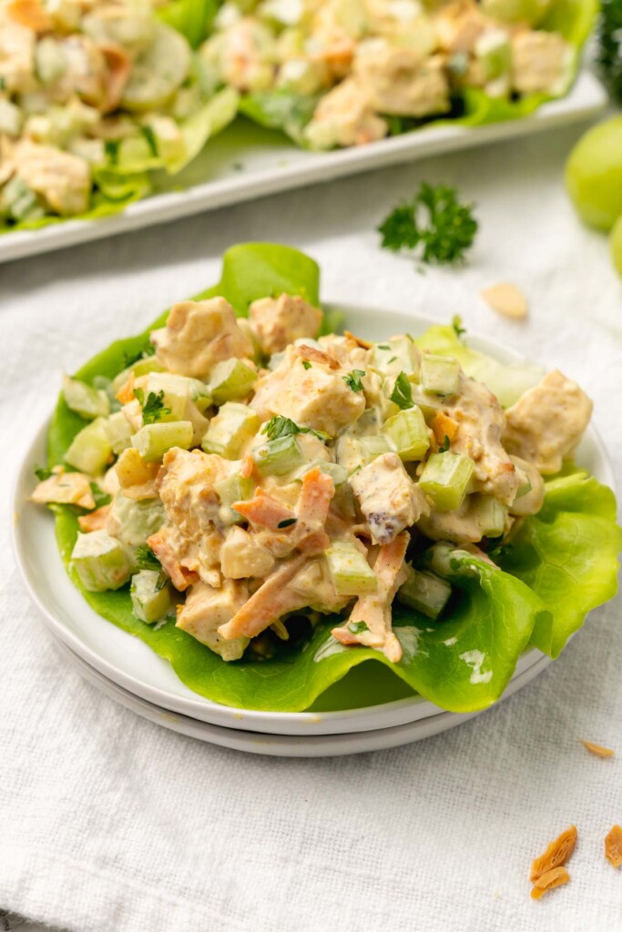 Party Chicken Salad is loaded with tender chicken, green grapes, carrots and celery topped with almonds and tossed in a creamy dressing. It's the perfect recipe for entertaining.