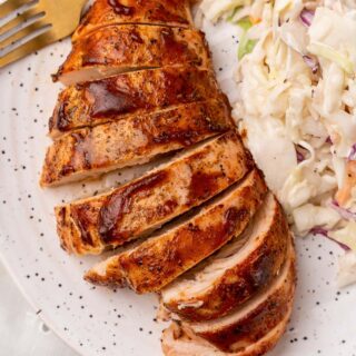Tender, juicy slices of BBq Chicken served with coleslaw for a backyard party any time of the year!
