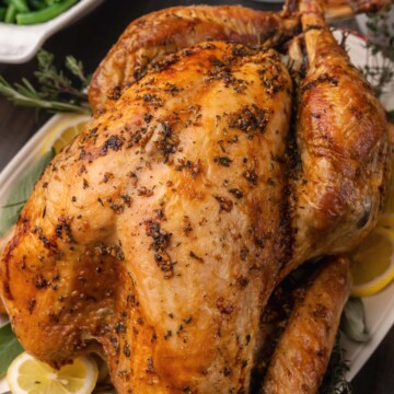Juicy, perfect Roasted Turkey with sage, thyme, lemons and garlic is perfect for serve for the holidays or any time you need a beautiful, delicious main dish.